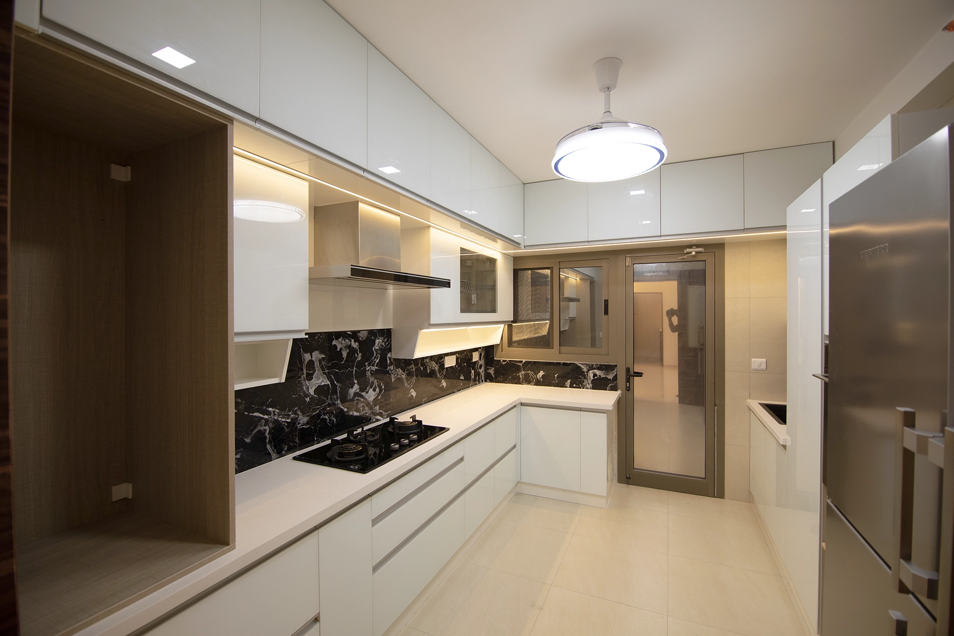 white lacquered glass modular kitchen