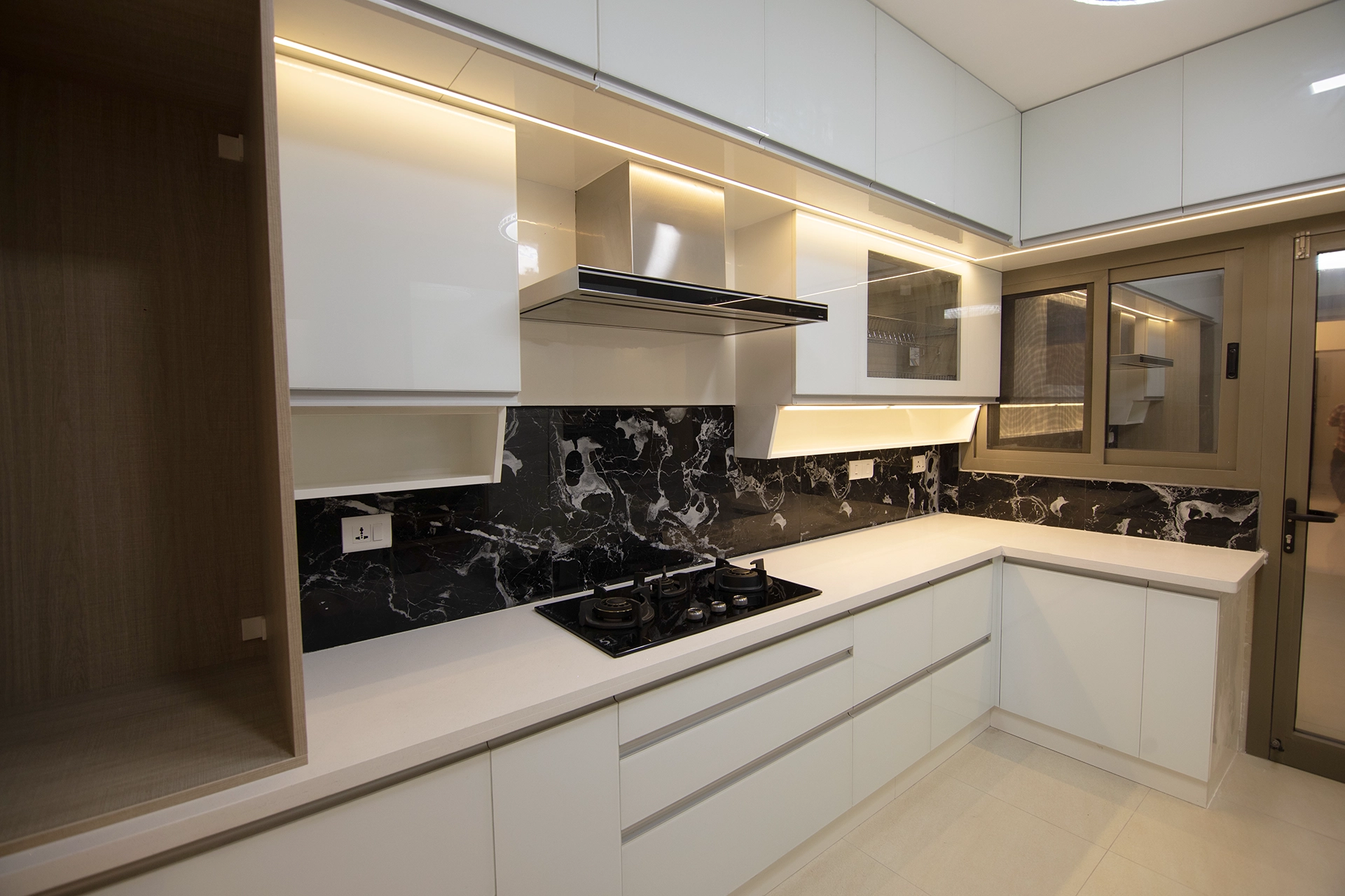 white lacquered glass modular kitchen